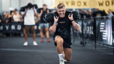 Técnica Sandbag Lunges Hyrox: Secretos Coach Técnica Sandbag Lunges Hyrox